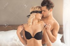94879785-young-couple-intimate-relationship-on-bed-passion.jpg